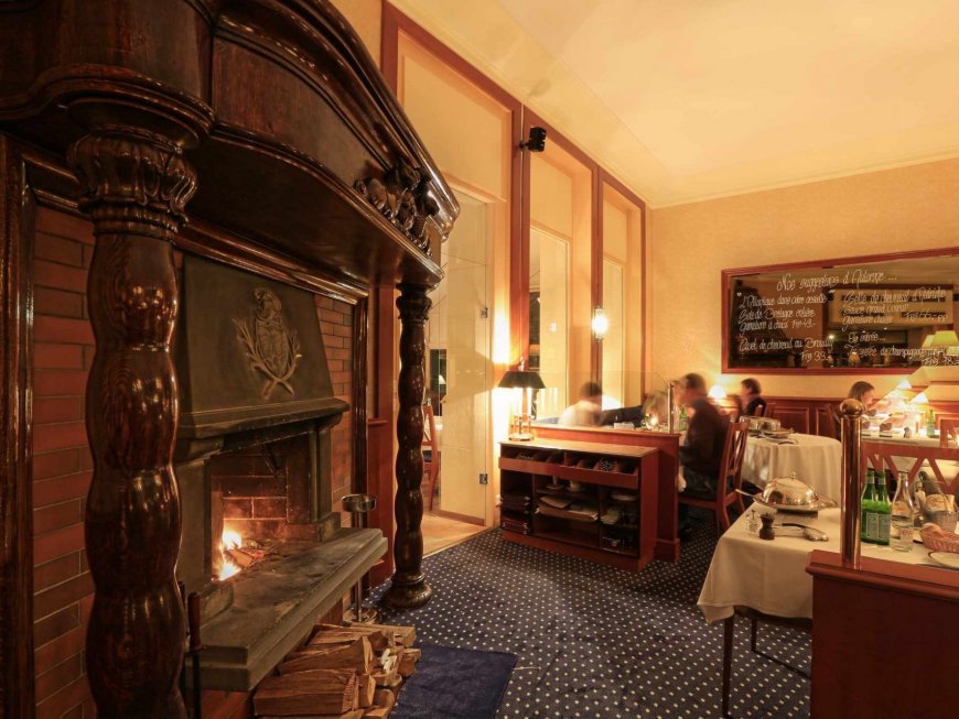 Dine or lunch by the cozy fireplace of Mirabeau Restaurant Lausanne for a gourmet and warm ambiance