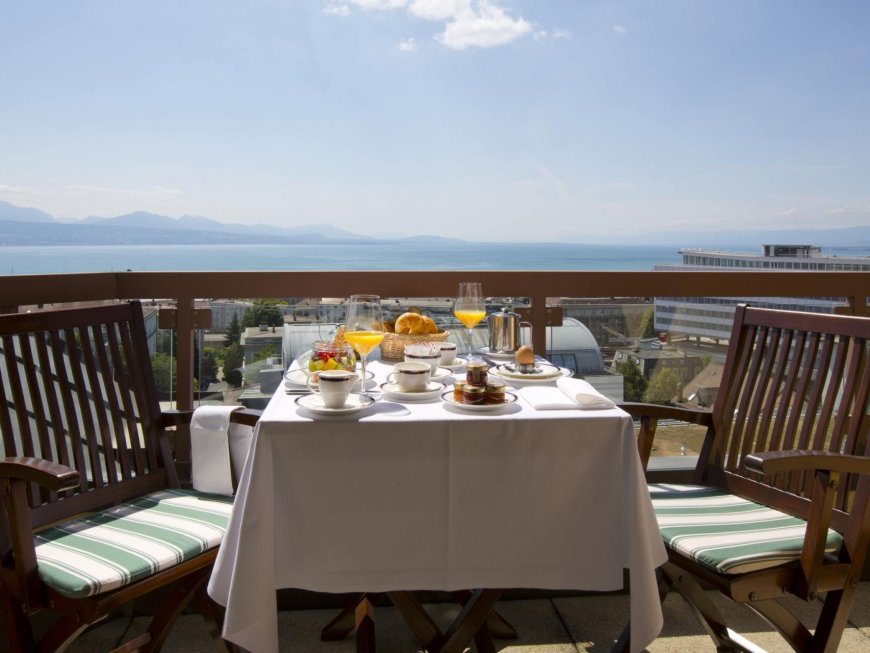 Morning view with breakfast from the Suite Room overlooking lake Geneva